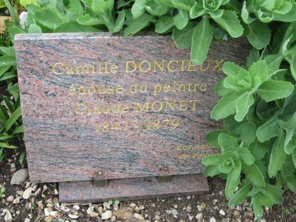 The new grave marker installed by a group of donors, Friends of Camille