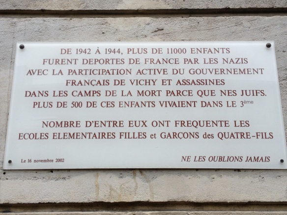 The plaque on a nearby school. It says: "From 1942 to 1944, more than 11,000 children were deported from France by the Nazis with the active participation of the Vichy government of France and assassinated in death camps because they were Jews. MOre than 500 of these children lived in the 3rd arrondissement. A number of them went to the elementary schools in this quarter. Let's Never Forget Them.
