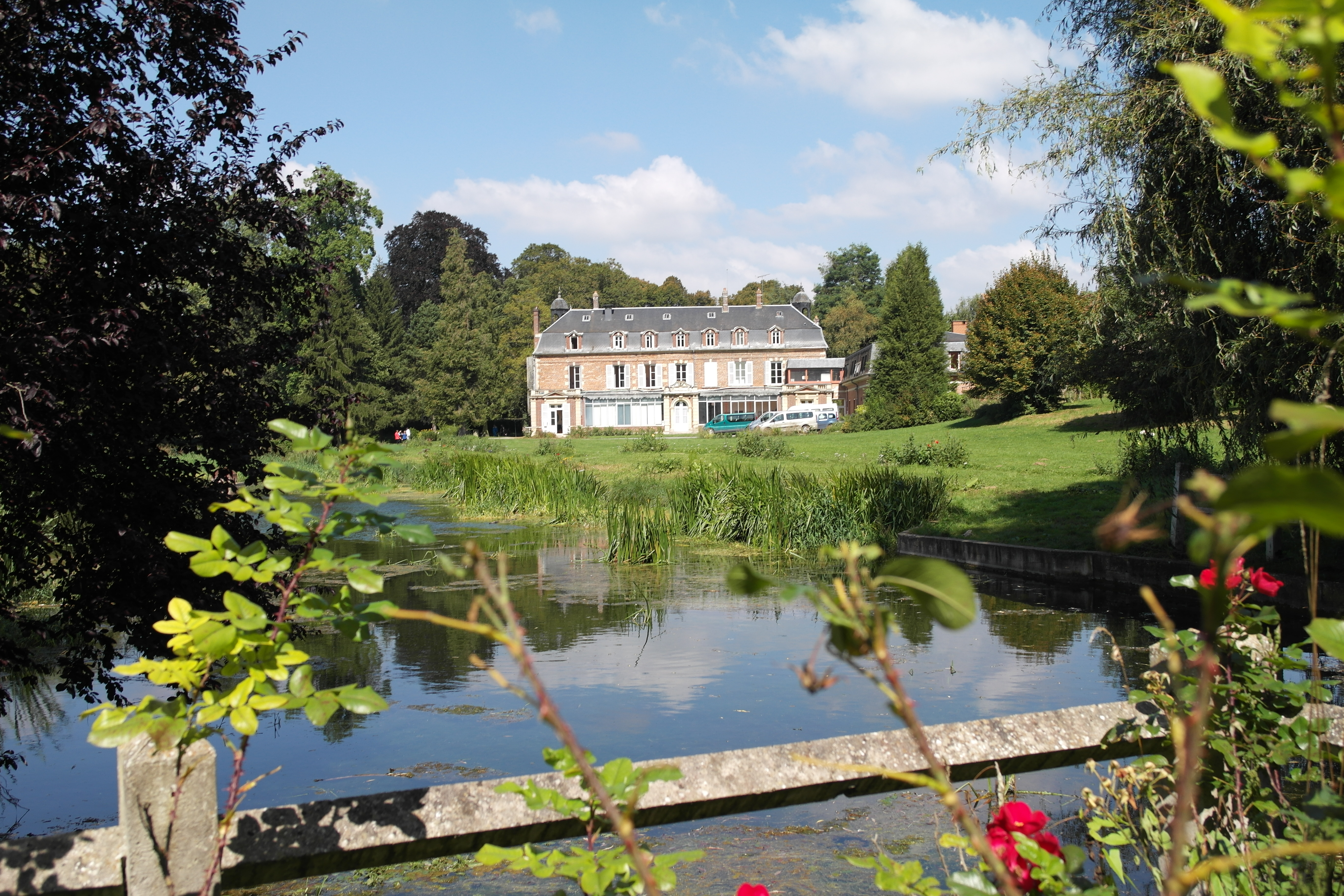The view of Chateau Beaufresne from the back of the property, across a lovely little lilly pond.