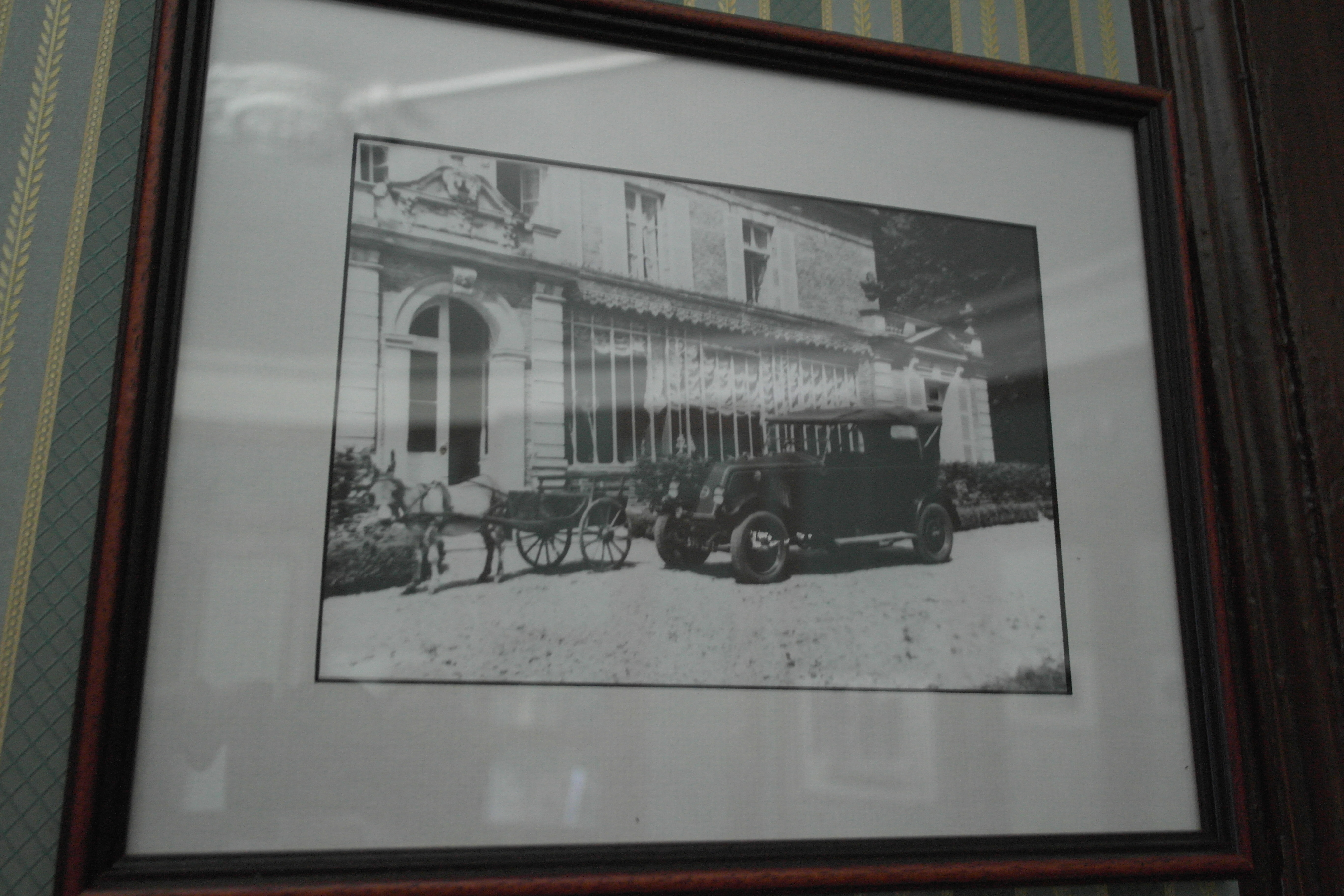 A framed photo on display in the chateau shows a car parked outside the back door in front of the gallery.