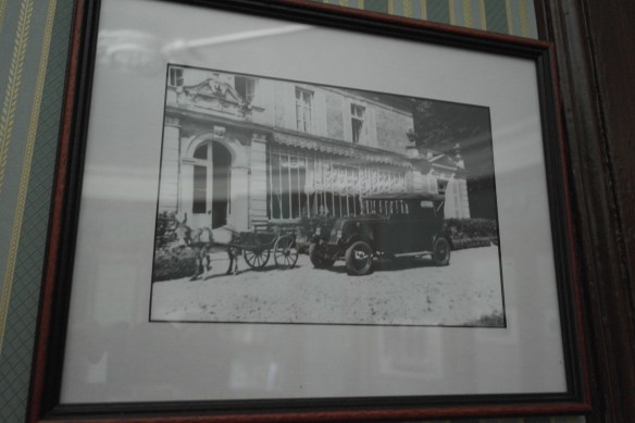 A framed photo on display in the chateau shows a car parked outside the back door in front of the gallery.